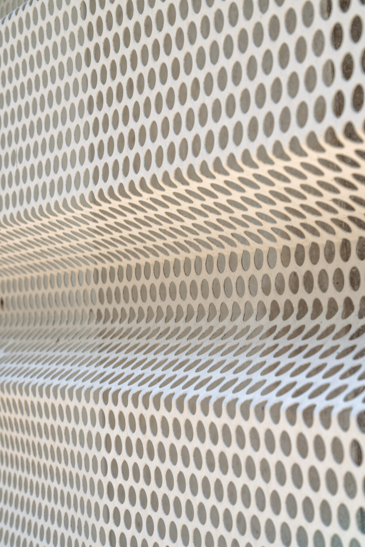 closeup of perforated metal siding